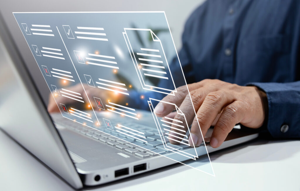 Image of a man typing on a computer